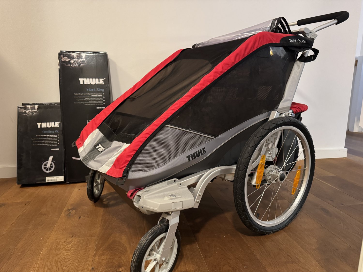 Thule Chariot Cougar 2 Kinderanhänger Rot inkl. Infant Sling und Strolling Kit Thule Chariot Cougar 2 Kinderanhänger Rot inkl. Infant Sling und Strolling Kit